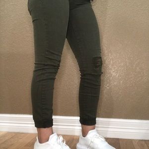 Distressed green jeggings